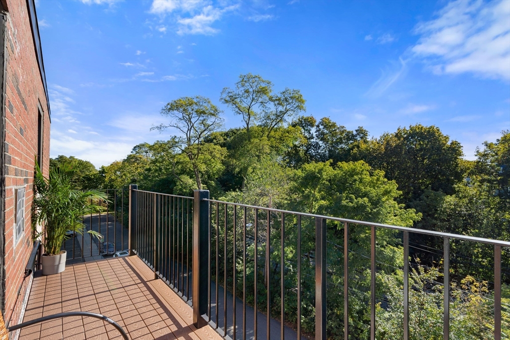 22 Branchfield Street, Unit D1 Boston, MA 02124 - Photo 5 of 20 a view of a balcony with an outdoor space