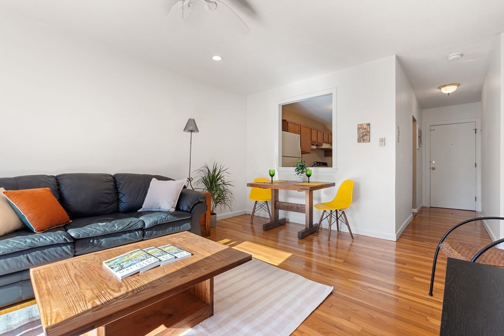 22 Branchfield Street, Unit D1 Boston, MA 02124 - Photo 6 of 20 a living room with furniture and wooden floor