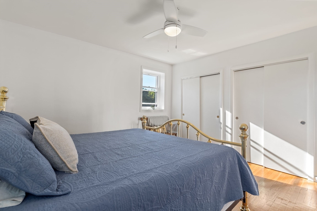 22 Branchfield Street, Unit D1 Boston, MA 02124 - Photo 9 of 20 a bedroom with a bed and a large window