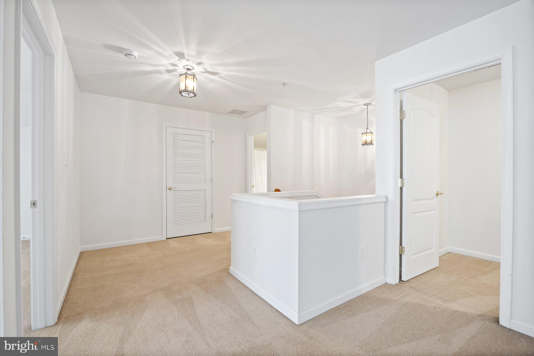 840 Horseshoe Lane, Unit 171 Taneytown, MD 21787 - Photo 25 of 37 a view of a hallway with closet and chandelier fan