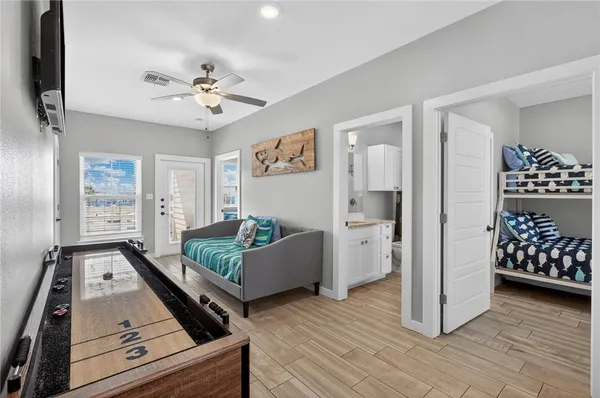 a living room with furniture and wooden floor