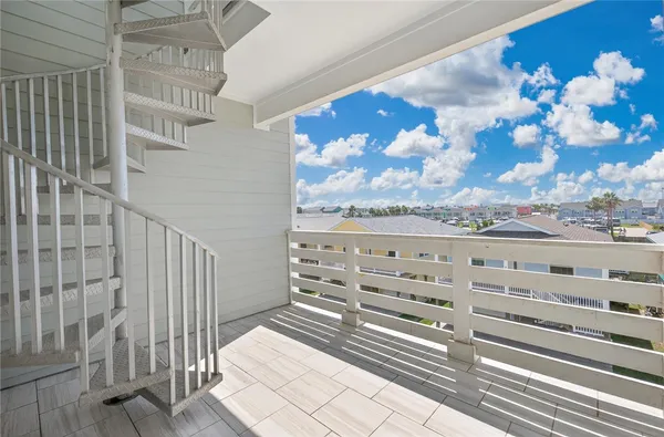 a view of a balcony with painting on the wall