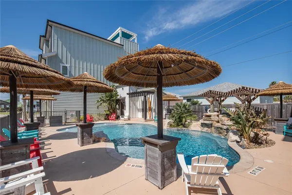an outdoor space with furniture and umbrella