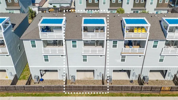 aerial view of a large building with a lot of windows and plants