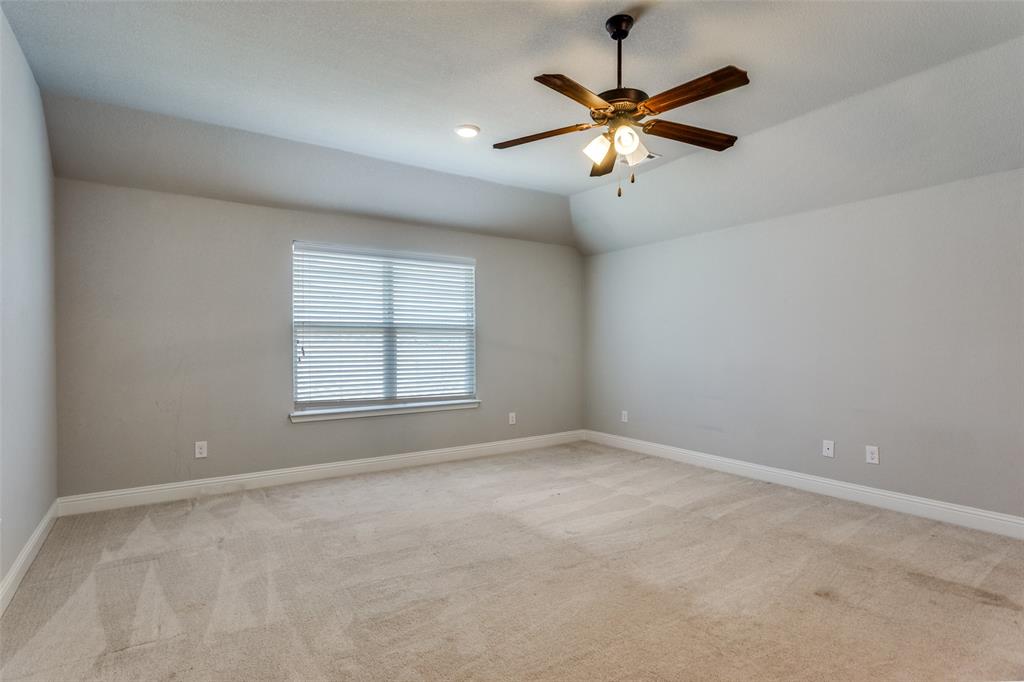 529 Inwood Street Benbrook, TX 76126 - Photo 11 of 29 an empty room with ceiling fan and window