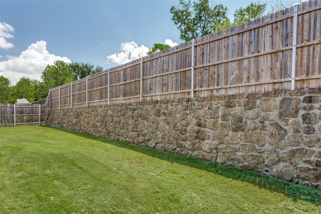 529 Inwood Street Benbrook, TX 76126 - Photo 25 of 29 a view of a backyard with wooden fence