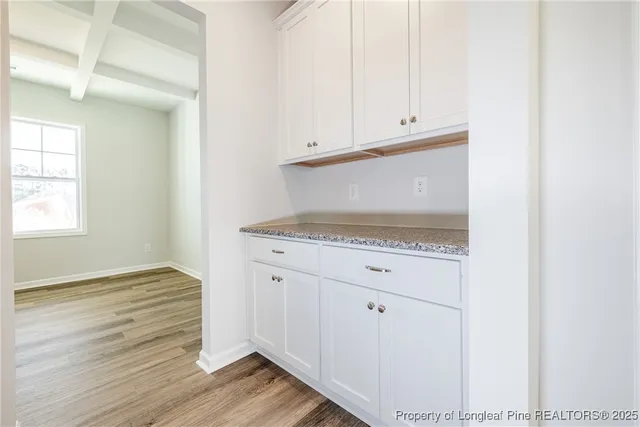 a view of kitchen with wooden floor