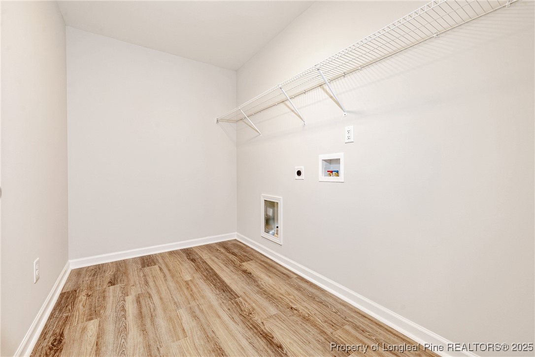 199 Palomo Place Raeford, NC 28376 - Photo 24 of 33 a view of a room with wooden floor and white walls