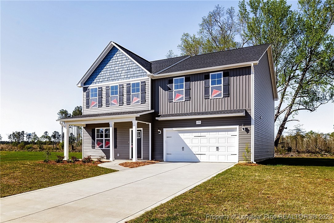 199 Palomo Place Raeford, NC 28376 - Photo 3 of 33 a front view of a house with a yard and garage