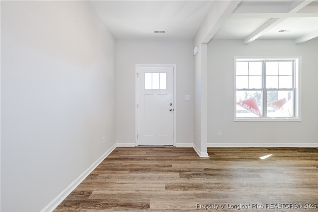 199 Palomo Place Raeford, NC 28376 - Photo 5 of 33 a view of a room with wooden floor and window