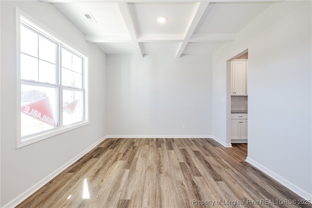 199 Palomo Place Raeford, NC 28376 - Photo 6 of 33 wooden floor in an empty room with a window