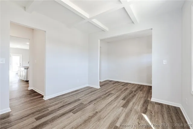 a view of wooden floor in an empty room