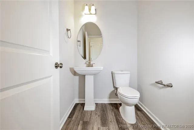 a bathroom with a toilet and a sink