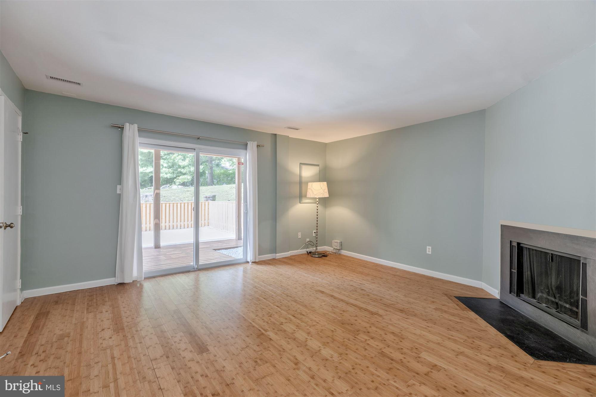3804 Ferrara Drive Silver Spring, MD 20906 - Photo 24 of 32 Family Room walk out to patio with Bamboo floors