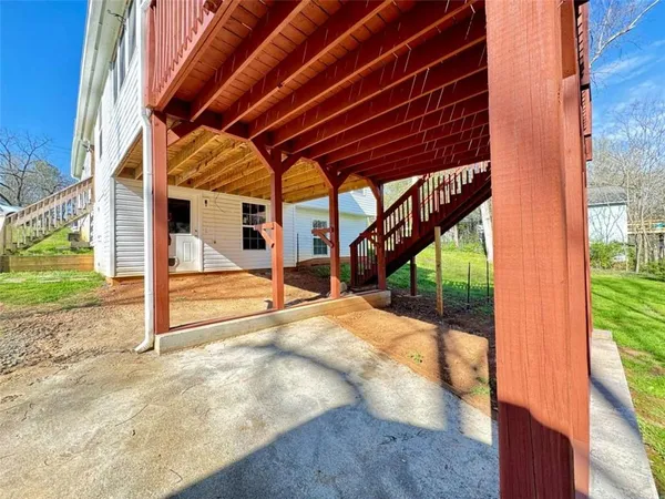 a view of a house with porch and wooden floor