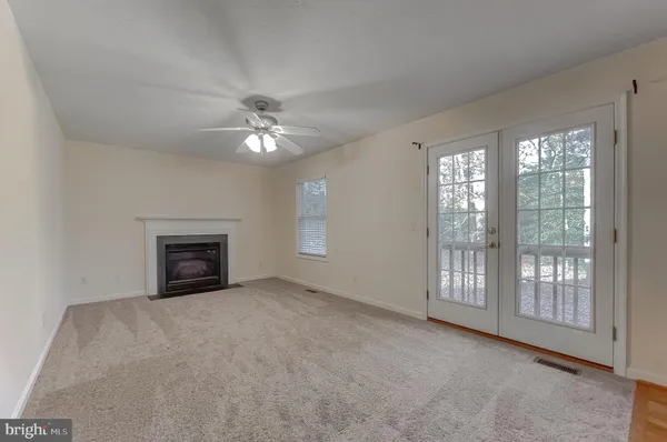an empty room with a fireplace