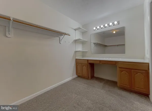 a bathroom with a bathtub and a window
