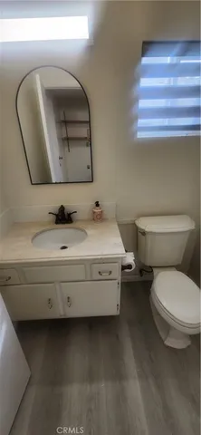 a bedroom with bed and a window