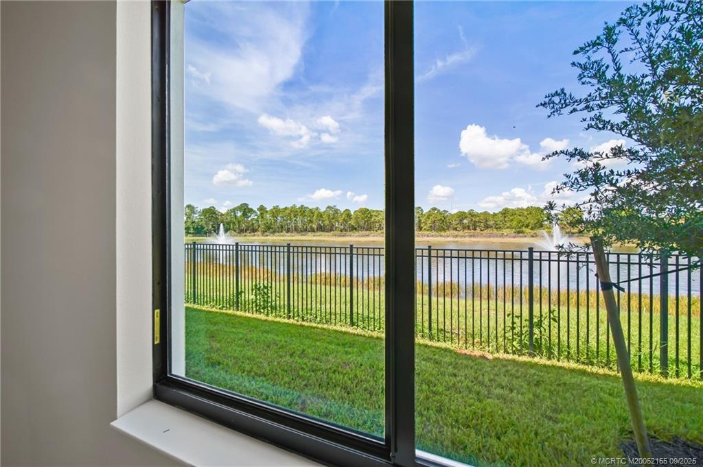 3654 Southwest Magnolia Ridge Lane Palm City, FL 34990 - Photo 11 of 23 a view of a yard from a porch