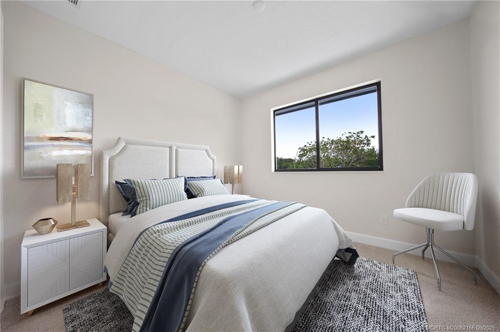 3654 Southwest Magnolia Ridge Lane Palm City, FL 34990 - Photo 19 of 23 a bedroom with a bed and a chair