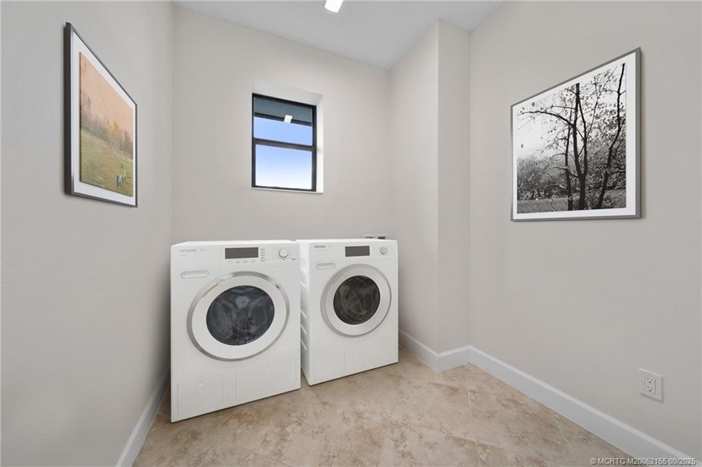3654 Southwest Magnolia Ridge Lane Palm City, FL 34990 - Photo 22 of 23 a utility room with dryer and washer