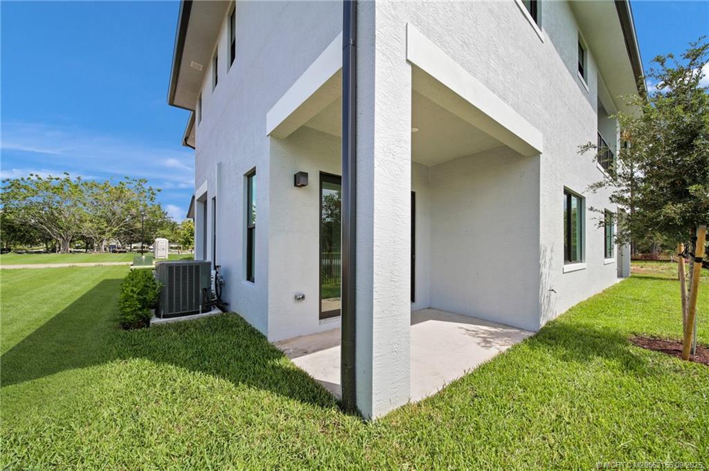 3654 Southwest Magnolia Ridge Lane Palm City, FL 34990 - Photo 4 of 23 a view of a balcony with a yard