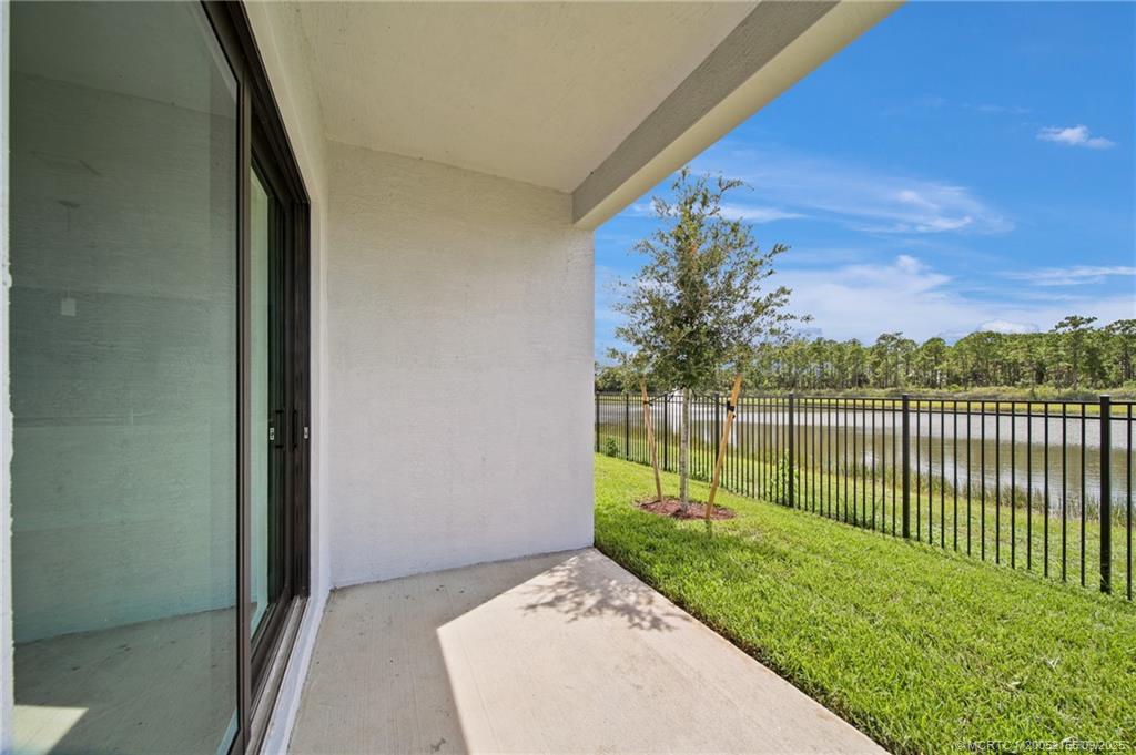 3654 Southwest Magnolia Ridge Lane Palm City, FL 34990 - Photo 5 of 23 a view of a backyard with a garden