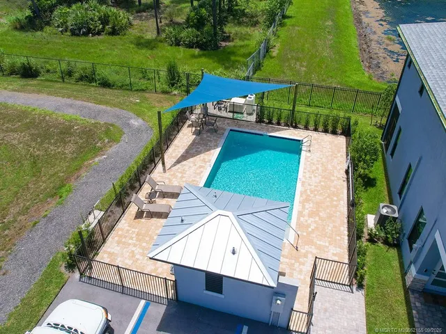 a view of a yard with furniture