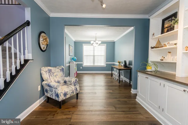a workspace with furniture hardwood and a window