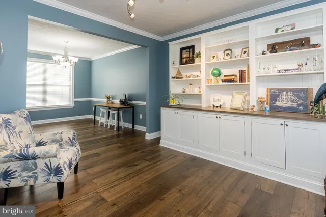 a room with stairs and a wooden floor