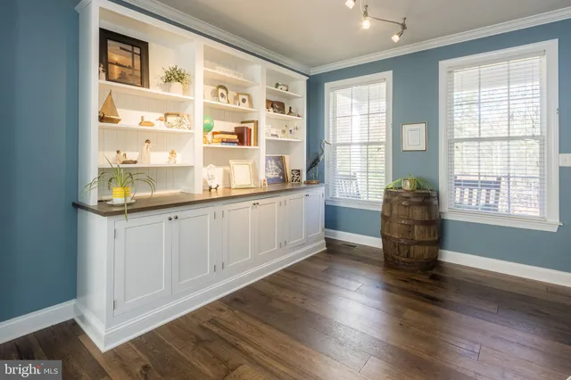 a workspace with furniture window and wooden floor