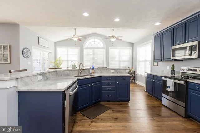 a living room with furniture a window and a fireplace