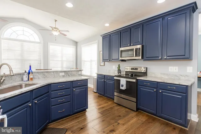 a bathroom with a sink a mirror and toilet