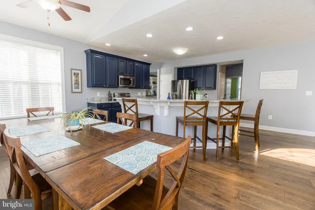 a view of a livingroom with a lounge chair and a window