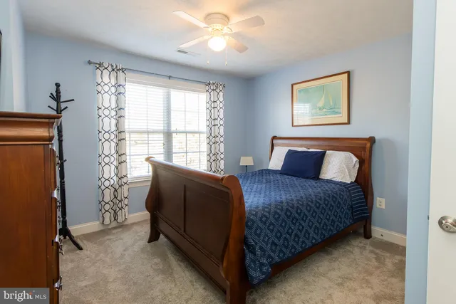 a bed room with a bed and a book shelf