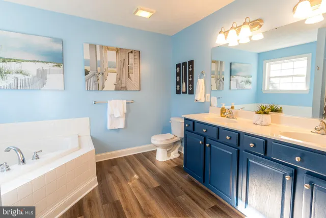 a living room with furniture and a chair