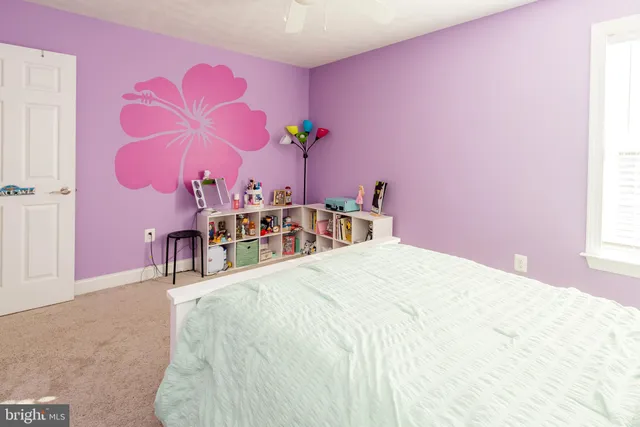 a kitchen with stainless steel appliances a stove a sink and a refrigerator