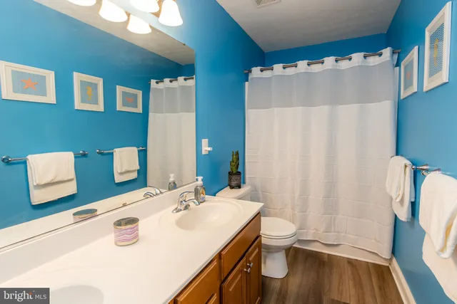 a kitchen with stainless steel appliances a stove a sink and a refrigerator