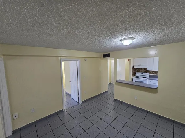 a view of a hallway with closet area