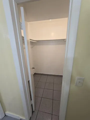 a view of a car park in front of house