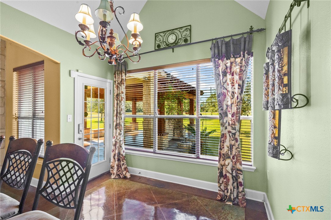 130 Post Oak Circle Inez, TX 77968 - Photo 11 of 48 a bedroom with a bed and a chandelier