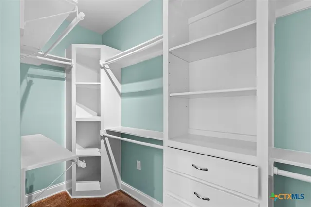 a view of an empty walk in closet