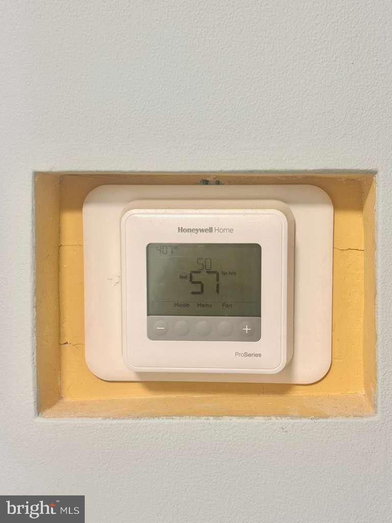 9278 Adelphi Road, Unit 103 Hyattsville, MD 20783 - Photo 11 of 24 a utility room with a fireplace