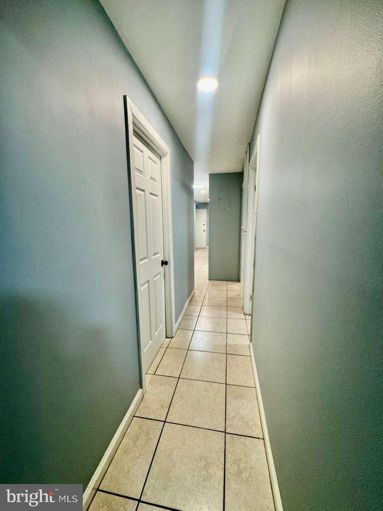 9278 Adelphi Road, Unit 103 Hyattsville, MD 20783 - Photo 22 of 24 a view of a hallway