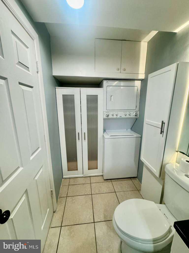 9278 Adelphi Road, Unit 103 Hyattsville, MD 20783 - Photo 23 of 24 a bathroom with a sink a toilet and a shower