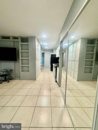 a room with a bed and furniture