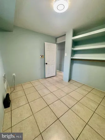 a room with a bed and a walk in closet