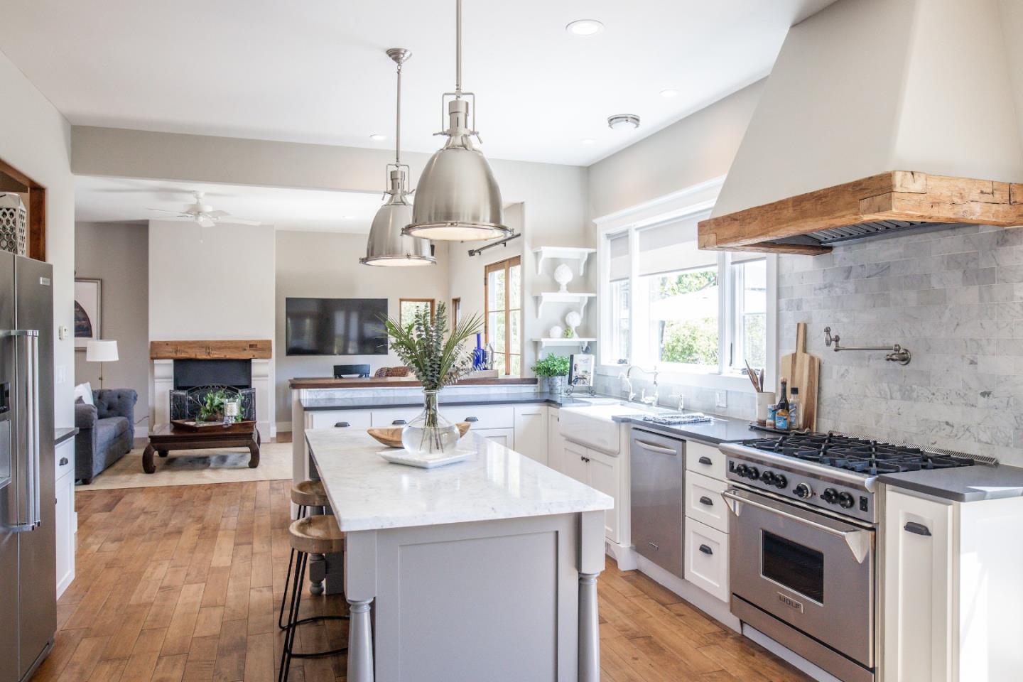 3430 Merrill Road Aptos, CA 95003 - Photo 14 of 49 a kitchen with stainless steel appliances a sink a stove and a wooden floors