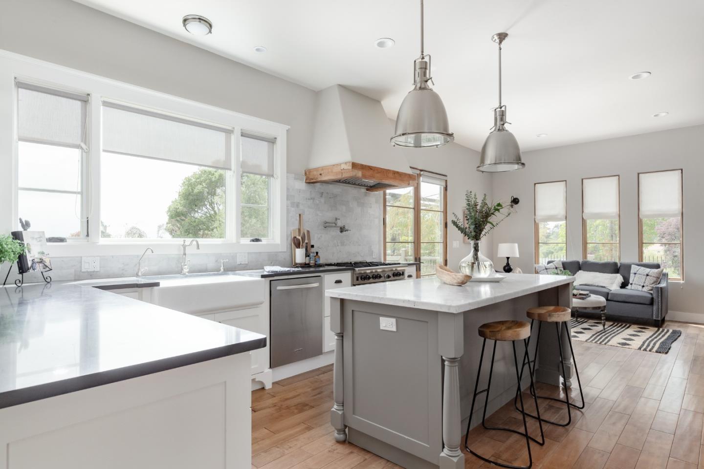 3430 Merrill Road Aptos, CA 95003 - Photo 16 of 49 a kitchen with stainless steel appliances granite countertop a sink a stove and a wooden floors