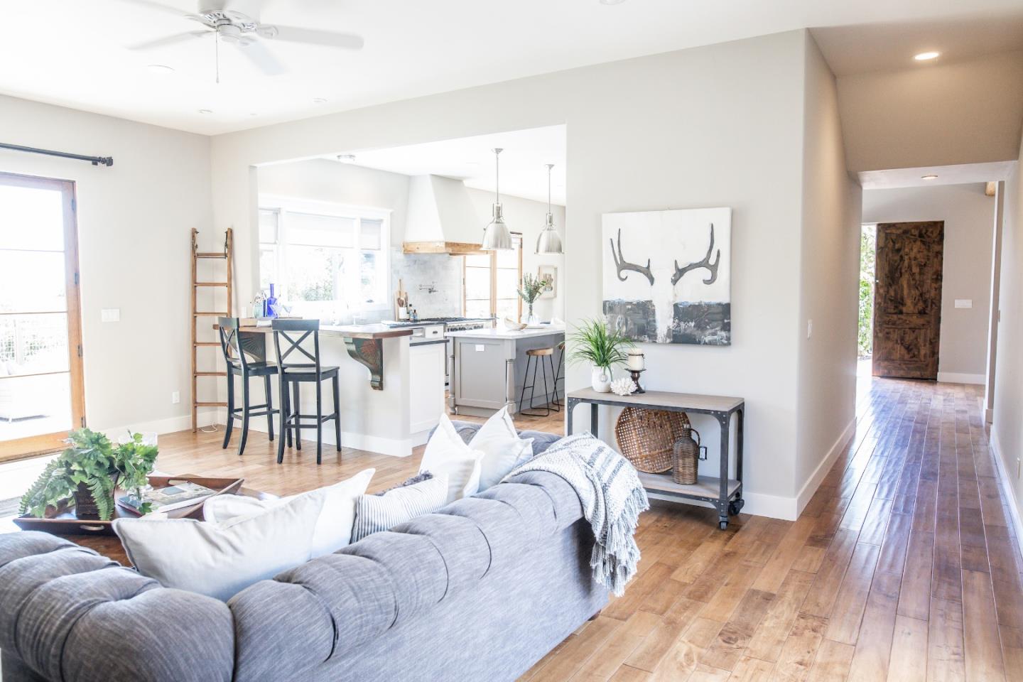 3430 Merrill Road Aptos, CA 95003 - Photo 20 of 49 a living room with furniture a fireplace and a table